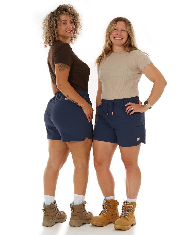 The Grind Overalls in motion, worn by model during outdoor activity
