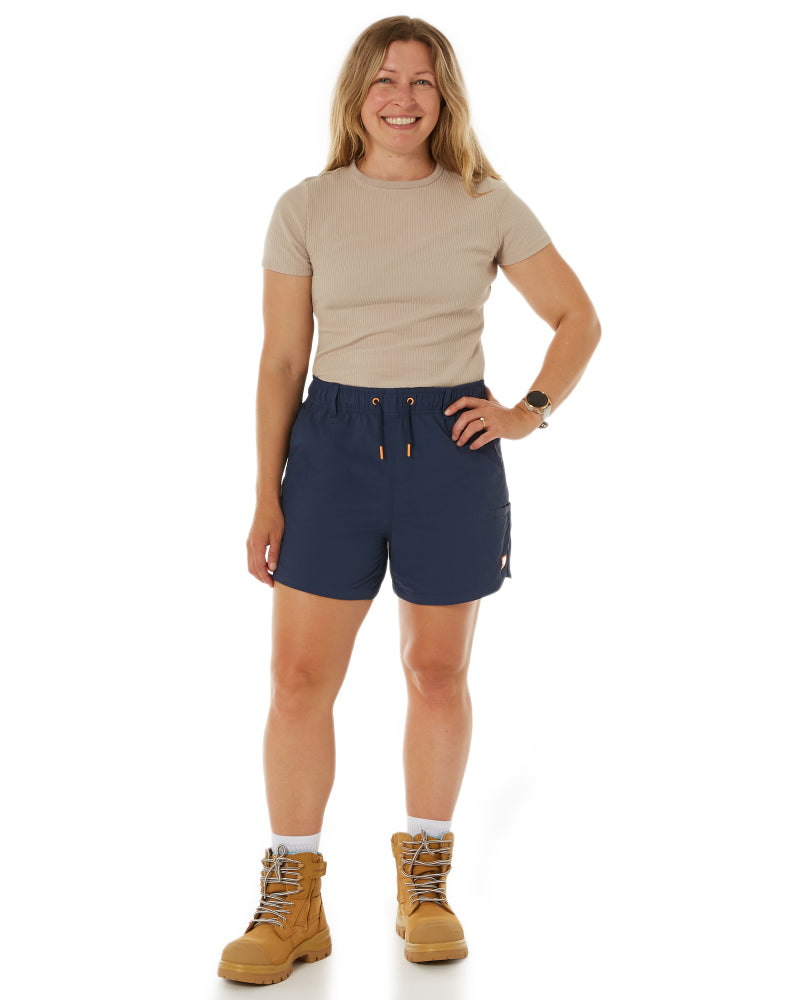 Model showcasing The Workz Pant in black from Zadie Workwear, illustrating the contoured slim fit and functional design.