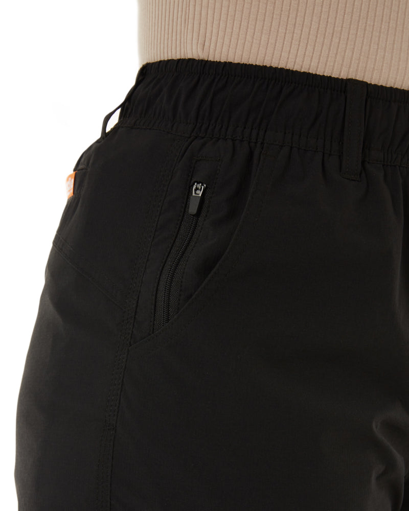 Close-up of Zadie Workwear's 'The Workz' shorts in black, showcasing the deep technical pockets and triple stitching.