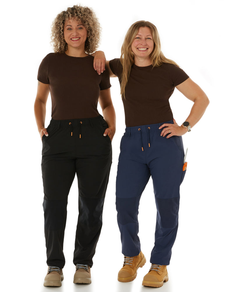 Model wearing Zadie Workwear's 'Grind' overalls in black, featuring adjustable straps and multiple pockets.