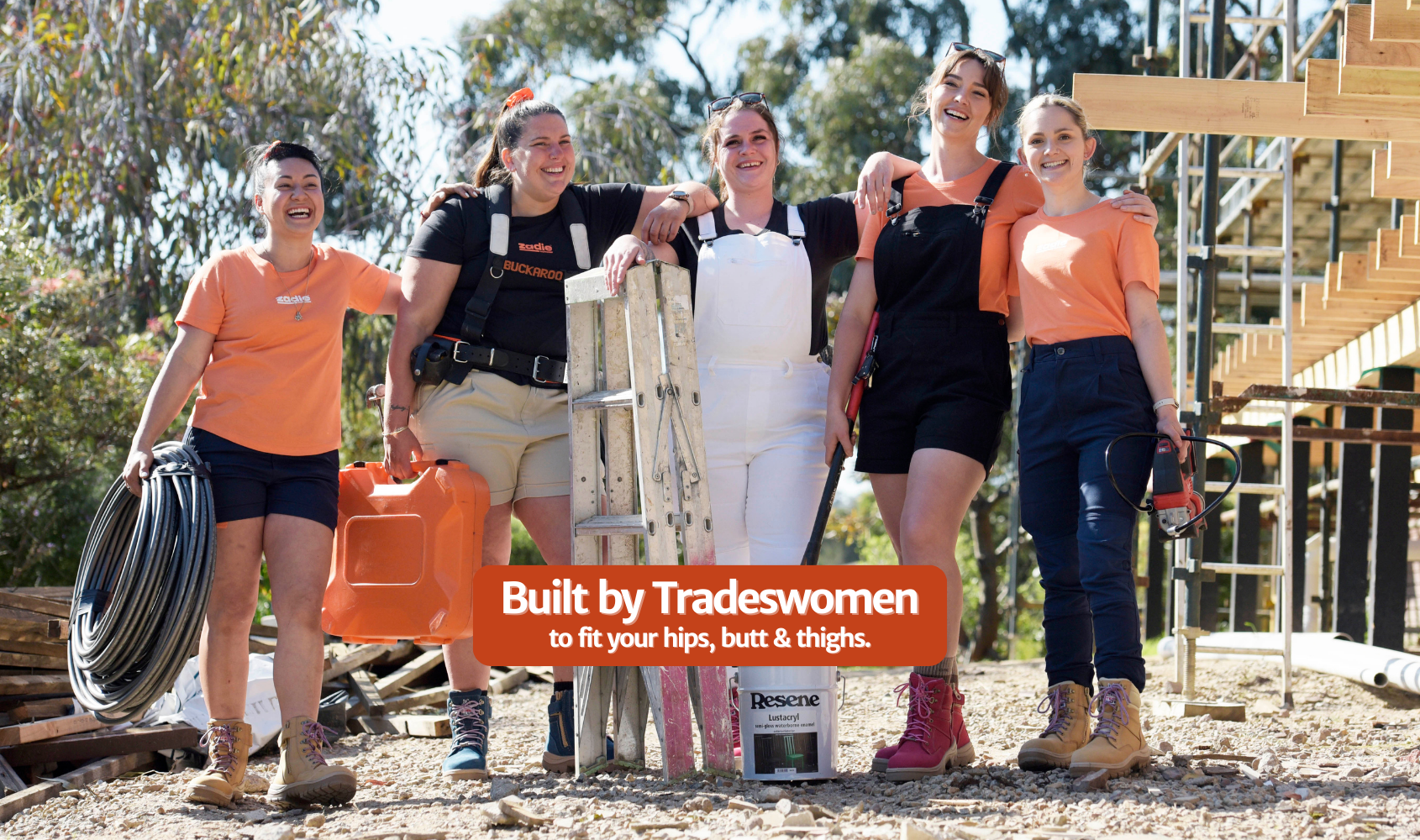 Built by Tradeswomen logo with a construction background