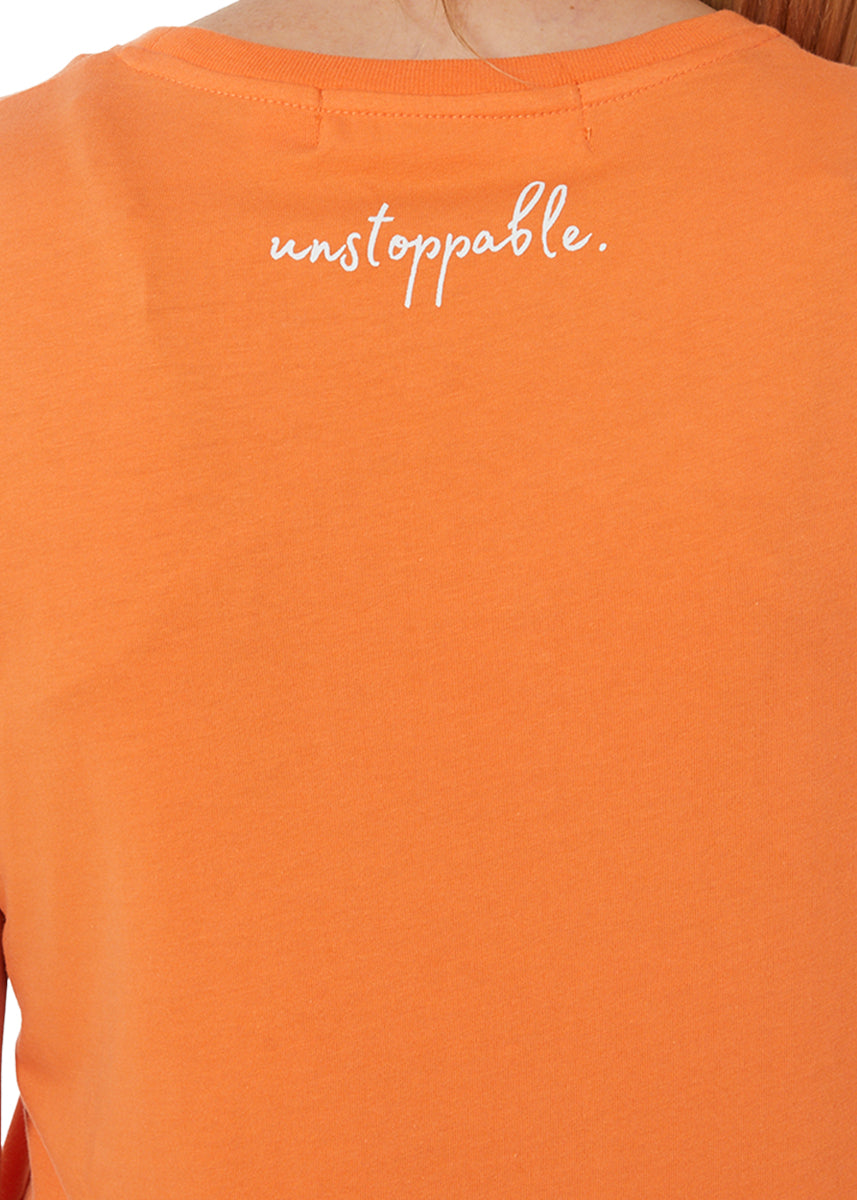 Rear view of an orange workwear tee highlighting its back design and simplicity.